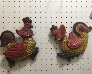 A vintage rooster and hen look quite serious about finding a new roost. 