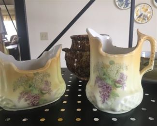 A hand-painted creamer set would coordinate well with china and more modern dishes. 