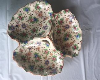 Tiny flowers dot this divided dish that’s pretty enough to hold jewelry. 