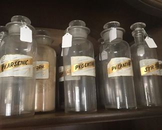 Old bottles from a long ago pharmacy in Tekonsha show some wear but the labels are easy to read. 