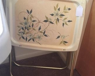 A pair of TV trays boast pretty flowers and are in great vintage condition.