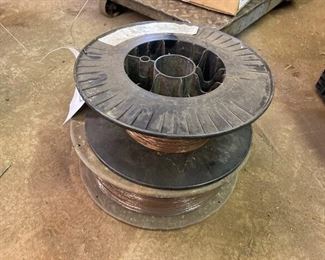 TWO PARTIAL ROLLS OF WELDING WIRE