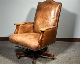 CUSTOM OFFICE CHAIR | Seven Seas Seating saddle brown leather executive's office chair on a wooden frame base swiveling with brass tacks
Dimensions: l. 32 x w. 28 x h. 42 in