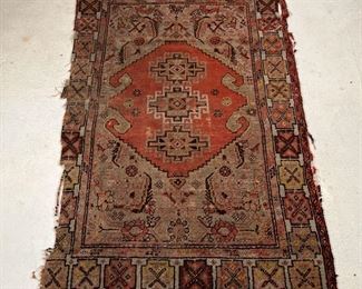 ANTIQUE CAUCASIAN RUG | Of small size, with central medallion
Dimensions: 64 x 39 in.