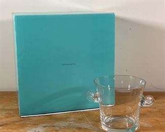 TIFFANY & CO. BLOWN GLASS VASE | Of tapered form with scrolled handles, signed on the bottom; with a large Tiffany blue box
Dimensions: h. 6 x w. 9 x d. 7 in.
