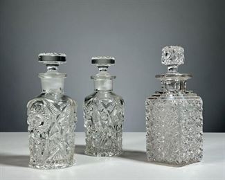 (3PC) CUT GLASS PERFUME BOTTLES | Including a pair of round bottles and a single bottle, each with a stopper
Dimensions: w. 2-1/2 x h. 6-3/4 in (square bottle)