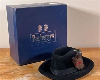 BURBERRYS RABBIT/HARE FUR HAT | Made in England by Burberrys, 100% black rabbit/hare fur, with feather; accompanied by original box
Dimensions: 12-1/4 x 10 in.