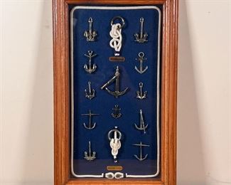FRAMED MINIATURE ANCHORS | Original anchor display of historical anchor types, and with sailor knots and anchor hitch display. Dimensions: 20 x 12 in. (frame)