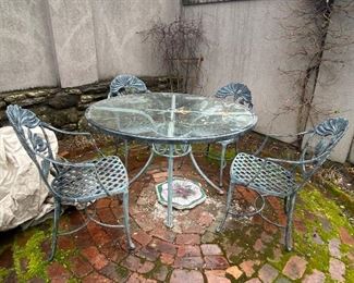 Metal patio table with glass top and 4 chairs 
