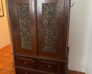 Armoire with clothing bar