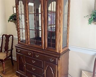 (F1) $225. Broyhill Lighted China Cabinet - moves in 2 pieces. Assembled it measures 18" deep x 52" wide x 82.5" tall. 2 glass shelves with plate grooves.  Overall very good condition - nice smaller size. 