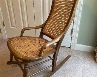 (F11) $75. Antique Caned Rocking Chair. Floor to seat measures 14". Floor to back measures 36"