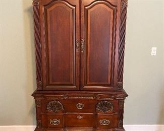 (F14) $450. Kathy Ireland Home Highboy Media Armoire / Entertainment Center. Moves in 2 pieces. Measures 24" deep x 41.5" wide x 87" floor to top of finial.  Could be used for clothes, games or a TV! Very good condition. 