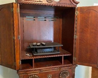 (F14) $450. Kathy Ireland Home Highboy Media Armoire / Entertainment Center. Moves in 2 pieces. Measures 24" deep x 41.5" wide x 87" floor to top of finial.  Could be used for clothes, games or a TV! Very good condition. 