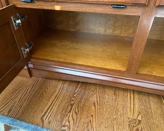 (F29) $150. Custom-made entertainment stand with granite top. Moves in 1 piece and *heavy*. Will need 2 strong people to move!