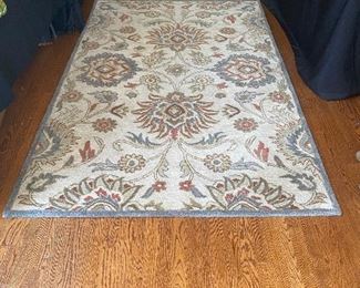 (R4) $225. Surya Rug wool - in sunroom area rug. 8' long x 5' wide. 
