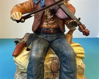 Cowboy Playing Violin. Melody in Motion battery operated figurine. Hand made and painted porcelain. Modeled by Seiji Nakane.
