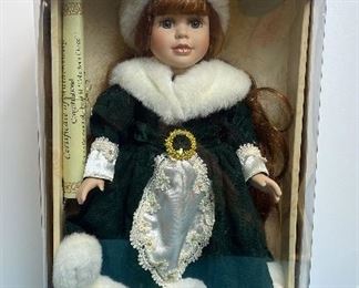 Genuine Fine Bisque Porcelain Doll. New in box collectible porcelain doll with certificate of authenticity.