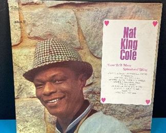 LP Record set of 3 albums by Nat King Cole. LP Record - set of 3 albums by Nat King Cole. Love is a Many Splendored Thing with cover and paper sleeve. Nature Boy has 2 albums with a fold open cover.