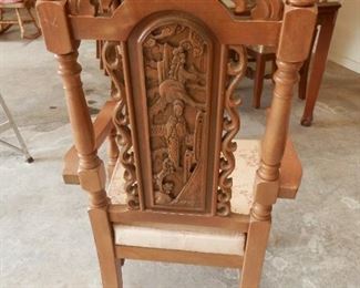 Rear view of beautifully carved Asian arm chair
