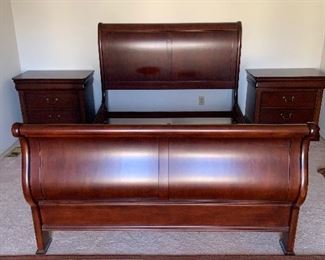 Newer bedroom set that includes bed, dresser with mirror, chest and matching end tables