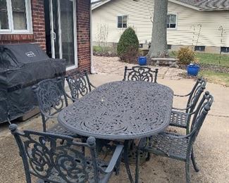 Large outdoor aluminum (will not rust) patio table and 6 chairs with covers