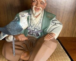 Japanese Hakata Mimasu Urasaki hand painted ceramic figurine of seated man and hawk