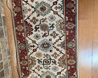 Brown and beige rug, 48" x 24"