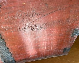 Carved words on exterior of antique painted travel trunk Rudsford, Minnesota