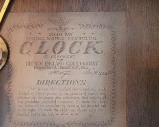 The New England Clock Co. small hanging clock in dining room