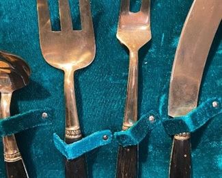 close-up of flatware, see details under 'Description"