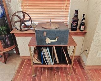 Record player powers on and works.... Needs a little work to play at correct speed. 