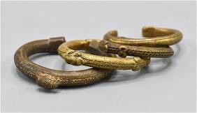Four Old and Antique African Bronze Round Cuff Amulet Bracelets
