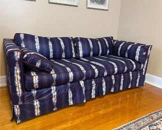 Navy blue abstract couch, red trim