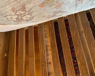 Wooden twin bed with bedding and mattress