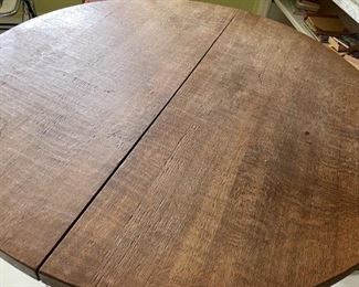 6 chair, round wooden table with light pink cushions 