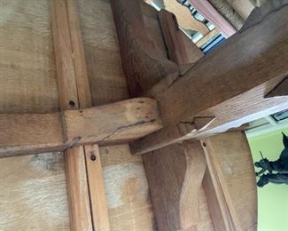 6 chair, round wooden table with light pink cushions 