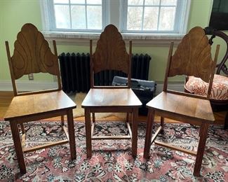 Trio of carved high back wooden dining chairs