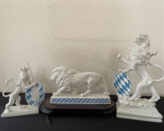 Porcelain heraldic lion sculptures, ivory colored with blue diamond print 