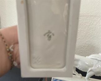 Porcelain heraldic lion sculptures, ivory colored with blue diamond print 