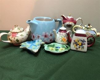 assorted tea pots and tea bag rests