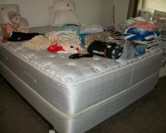 queen size bed, lots of linens, baby clothes