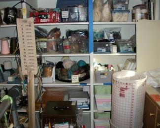 cutting mat, knitting needles, yarn, thread, macrame cord, lots of knitting books