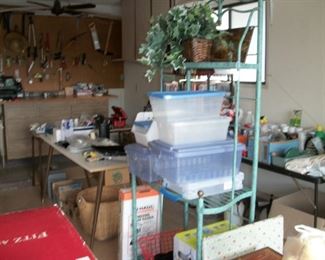 bakers rack, storage containers, wrapping paper, garage stuff