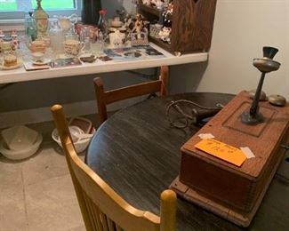 antique telephone, round table, misc wood chairs, cow collection, misc glass