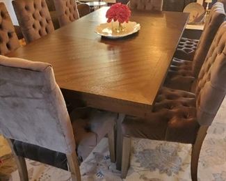 Dark wood dining table with leaf and 8 dark grey velvet chairs 
Table- 78x42
Chairs are 39 inches high