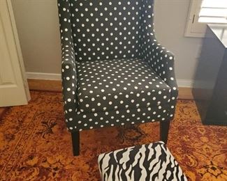 Black and white polka-dot chair and zebra print step stool