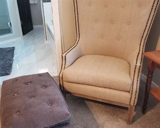 Beige wing back chair with bronze studs.   45 inches high
Dark grey ottoman 
30x20x16