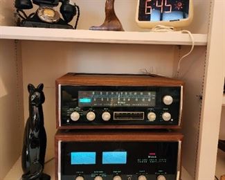 Antique bakelite rotary phone, unique desk lighter made from an antique furniture leg, rare Lumatime mechanical/digital clock c. 1970s, Royal Haeger winking cat, McIntosh