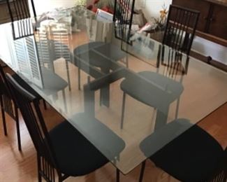 Absolutely stunning dining room table in perfect condition measurements are 42” wide by 72 “ long with 8 chairs.